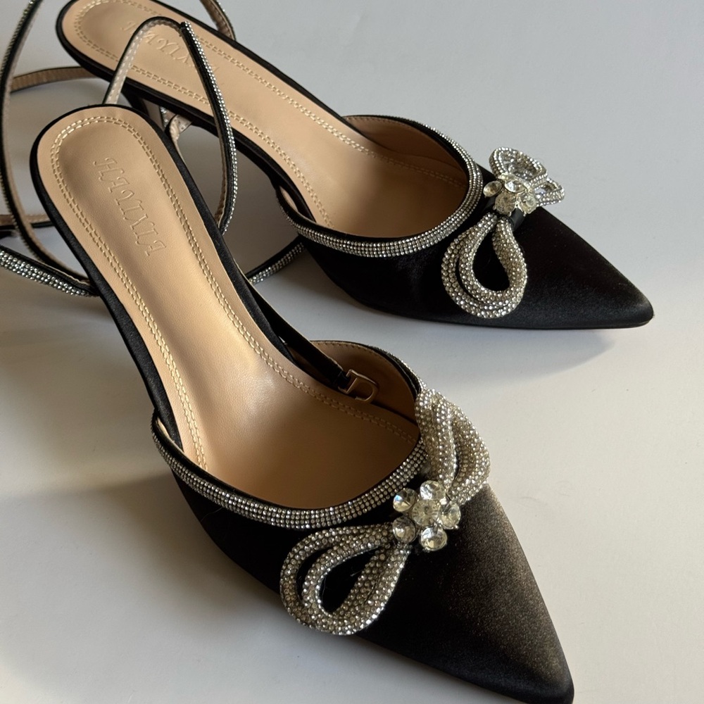 Bow heels. Satin finish. Size 10.
